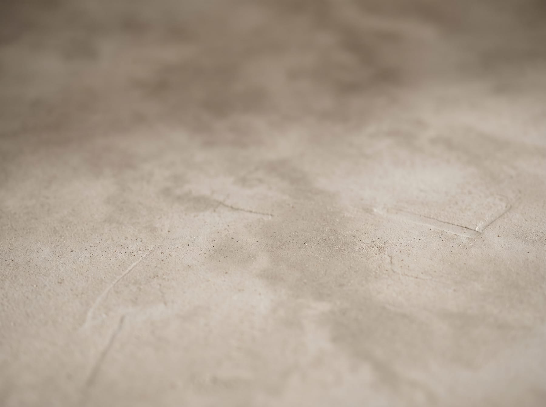 Microcement surface detail showing its matte, jointless texture