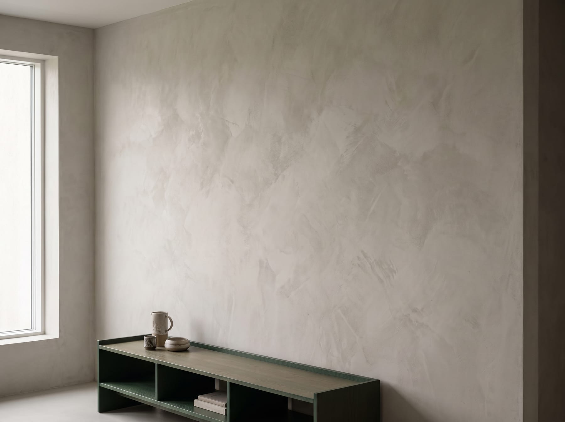 Hand-trowelled microcement feature wall with soft mineral movement, Dubai