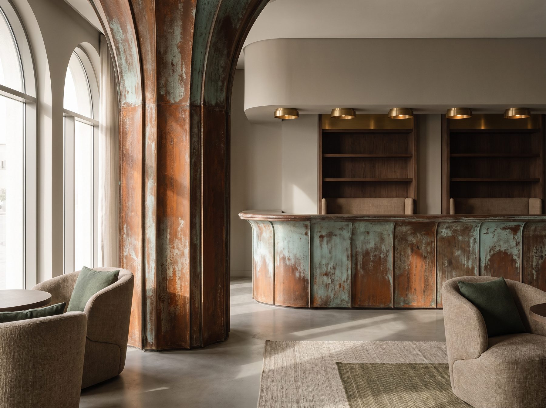 Hotel lounge with a rust-and-verdigris column and curved reception bar front beside arched windows